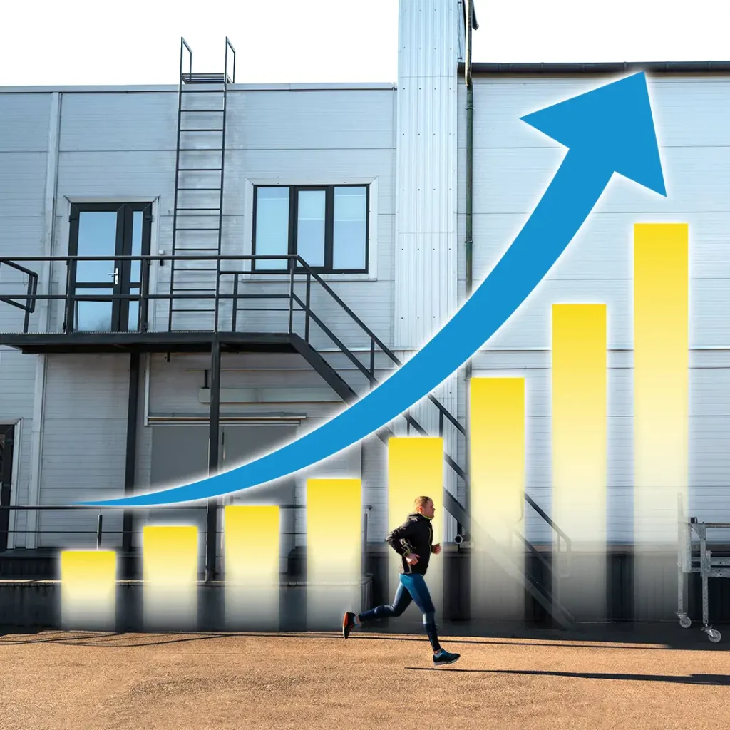 Runner in athletic gear passes a rising bar chart with a blue growth arrow beside an industrial building, conveying progress.